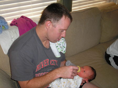 CHRIS WITH EVAN AT 5 DAYS OLD