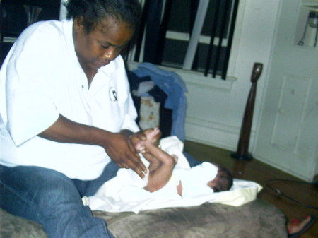 Mom changing Jada's diapers