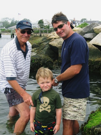 Jamie, Dad, and Grandpa catching a crab dinner