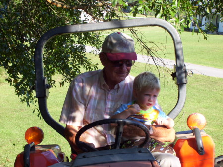 FATHERINLAW WITH GRANDSON 0N TRACTOR