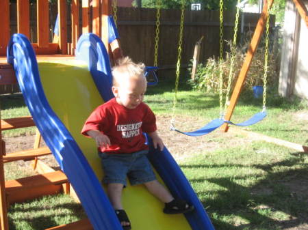 Andrew and his new swing set