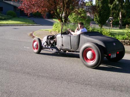 My kid driving his friends 26 Model T roadster