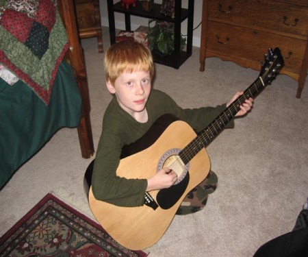 My nephew gage playing my guitar - 2008