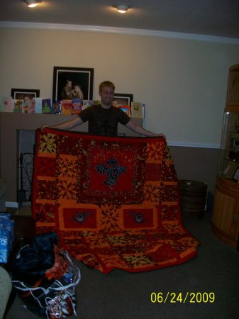 my son Josh with the quilt I made him