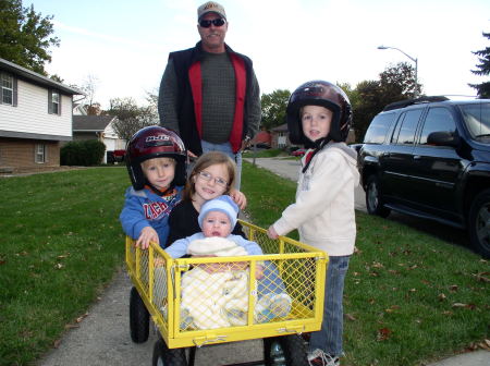 Wendell pulling all the grandkids