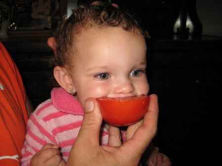 Aleciana Loves maters from our garden!