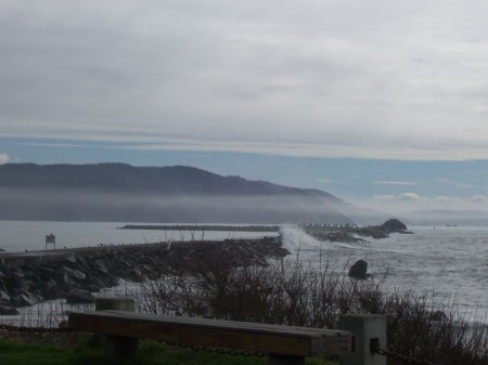 Surf Crashing Over Breakwater.