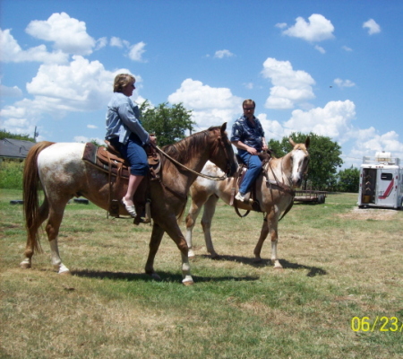 Donna and Tom riding our horses.