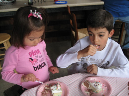 SIS AND AARON THROWING DOWN CAKE!