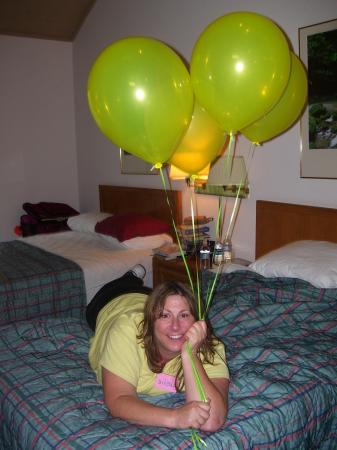 me holding balloons