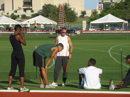 Chris, Jr. talks with fellow teammembers