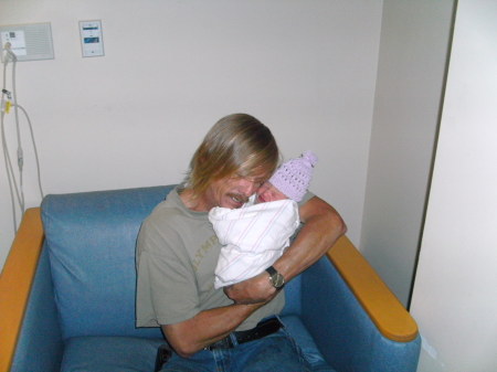 My husband holding our new addition