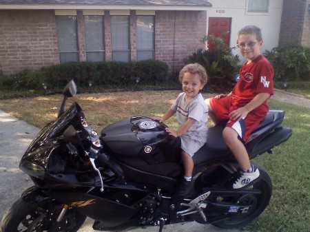 Conner and Ethan sitting on daddy's new bike