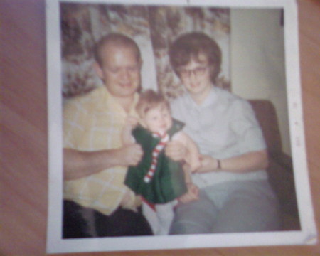 my mom and dad with me first christmas