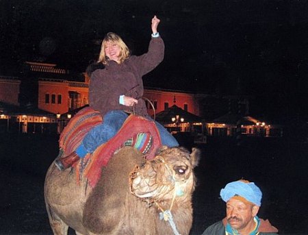 Leslie riding a camel in Morocco (Jan 2009)