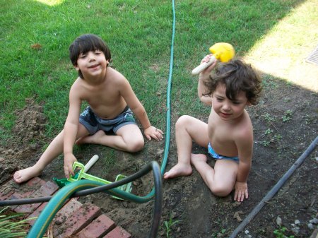 Julian and Jaden playing in the water.