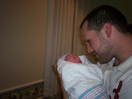 My youngest son ,Troy,holding my first Grandso