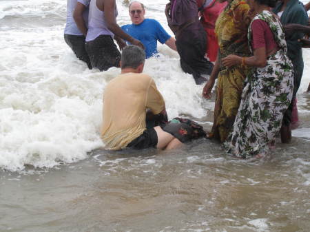 Kurt baptizing a lady