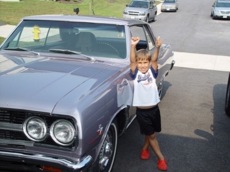 Our son Charlie and my 1965 purple Chevy