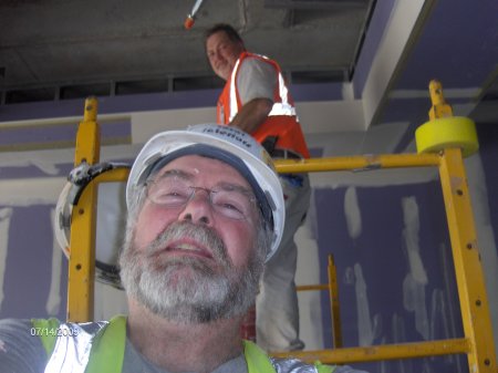 Union drywall finisher at work at arrowhead