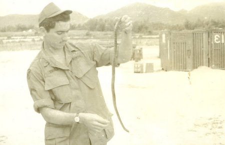 Jerry Brewer with a snake in Vietnam