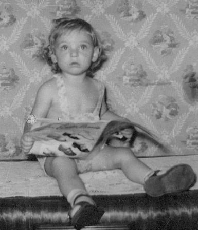 Julie "reading" at age 3