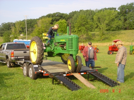 Dad unloading the tractor
