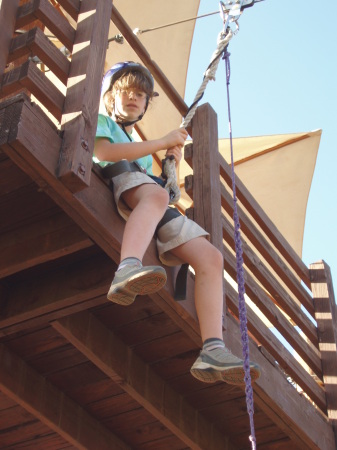 Carly on zip line at Girl Scout Camp 2009