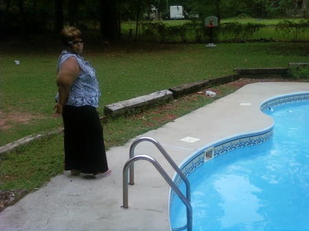 standing in front of my pool.