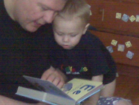 Daddy and Jacob reading a book