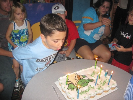 Derek blowing out his candles