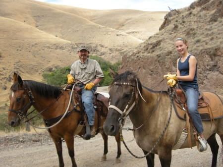 Riding horses with my daughter.