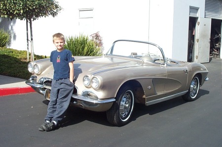 A young Tommy at my shop with one of our cars.