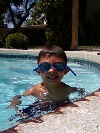 Daevin in our pool with  his goooogles