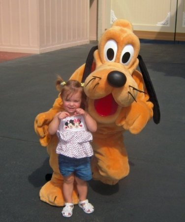 Granddaughter posing with Pluto