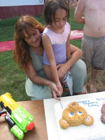 nanna (rhonda) n trinidy cutting cake