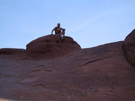 me sitting in the middle of broken arch