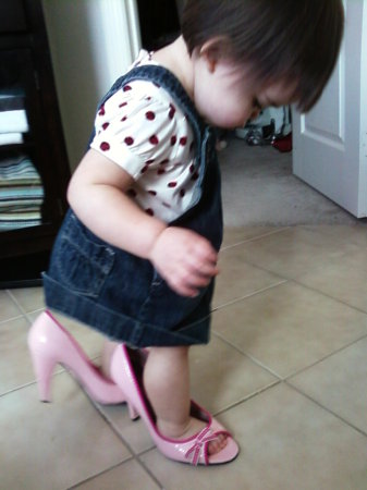 Samantha with her mom's shoes