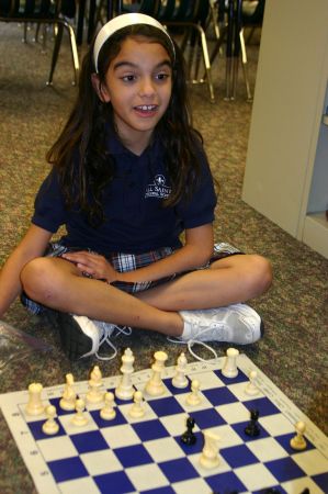 zoie playing chess at school