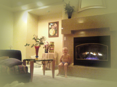 Chris warming by the fireplace after his bath