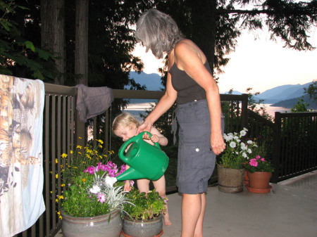 Our Grandson helping Hilary on the deck