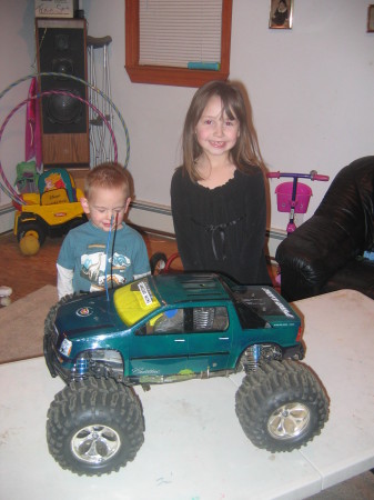 john jr and kaitlyn next to daddy's toy