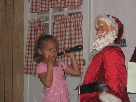 My baby singing Kareoke with Santa