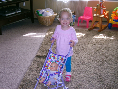 Our little JaCee w/her new baby stroller.