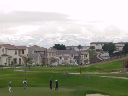 Playing golf in January with snow on mtns.