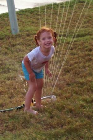 CELIA IN THE SPRINKLER