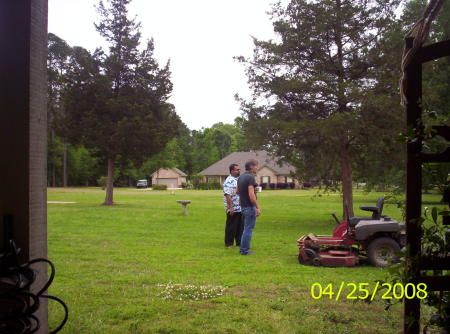 tommy and vijay looking at the mower