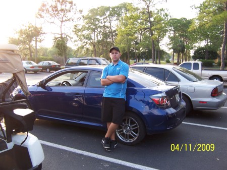 My son Brett with his new car.