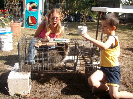 barb,and son shaun with racoon