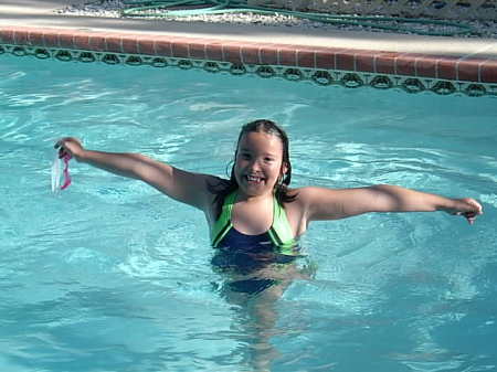 ALICIA HAVING FUN IN THE POOL AND SUN